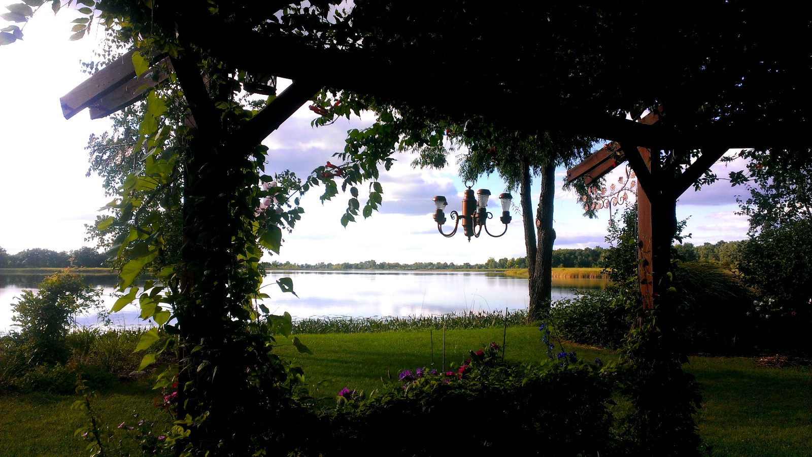 The lake where it enters the side channel, standing under the Flowering Gazebo.
